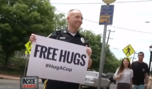 James Spadola as a "Hug a Cop" Newark police officer, pictured by Inside Edition.